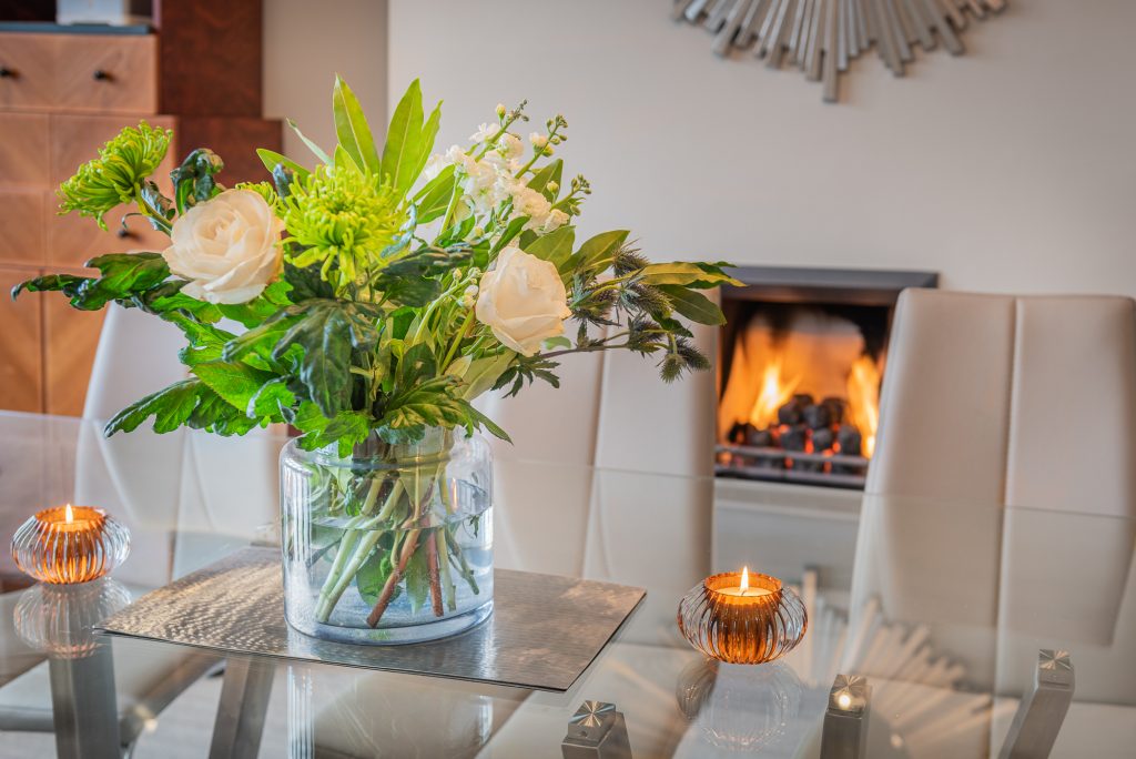 flower display infront of fireplace