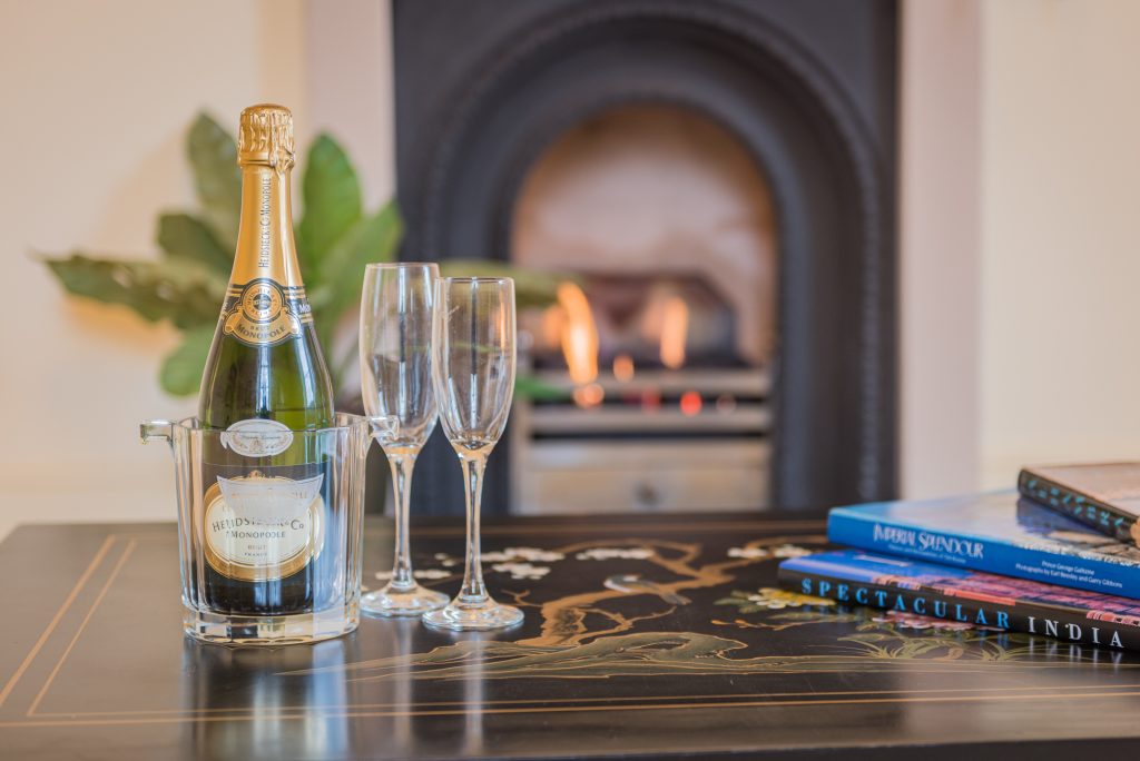 Champagne infront of fireplace